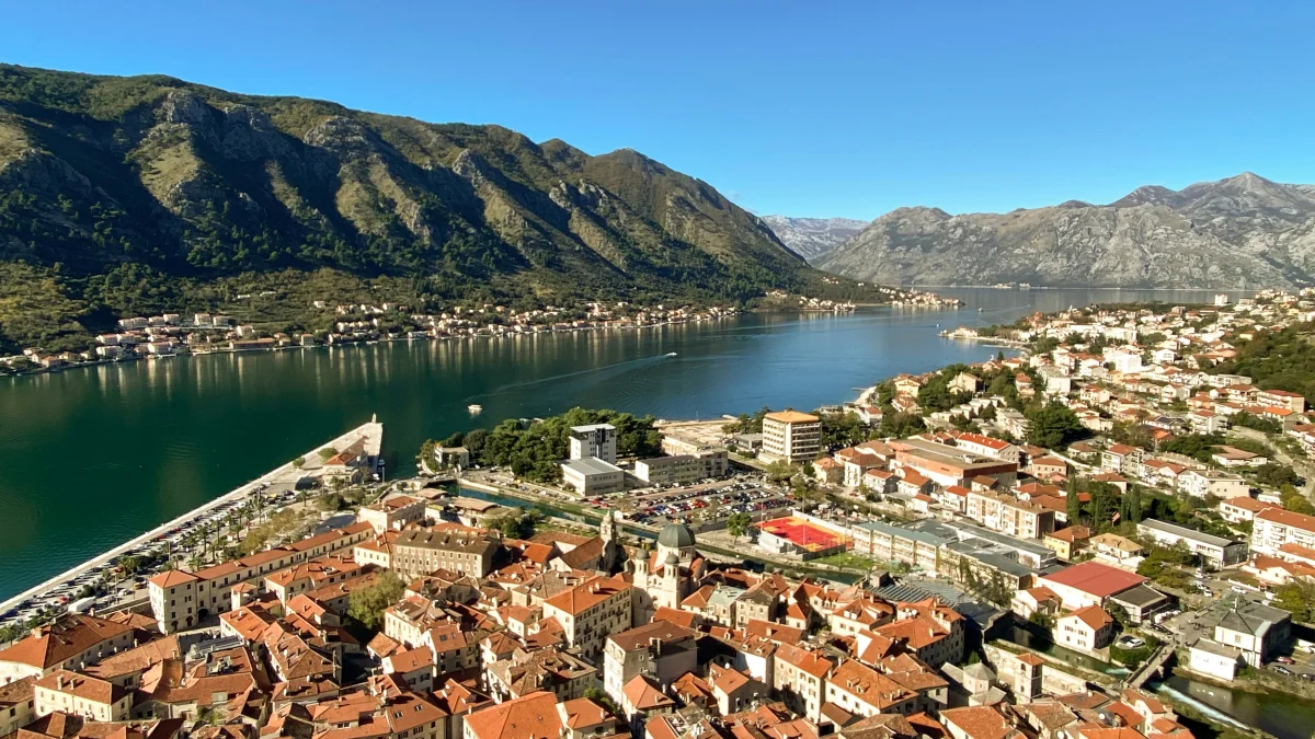 The Bay of Kotor from the fortified old town — fjord-like Adriatic inlet backed by steep mountains (Unsplash)