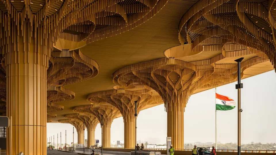 Golden timber canopy columns at the departures forecourt of Lokapriya Gopinath Bardoloi International Airport Terminal 2, Guwahati