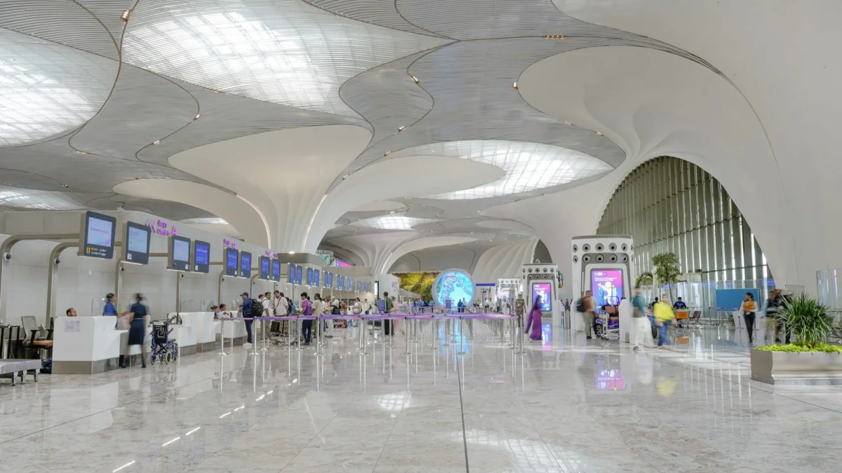 White organic interior of Navi Mumbai International Airport Terminal 1 with flowing ceiling forms