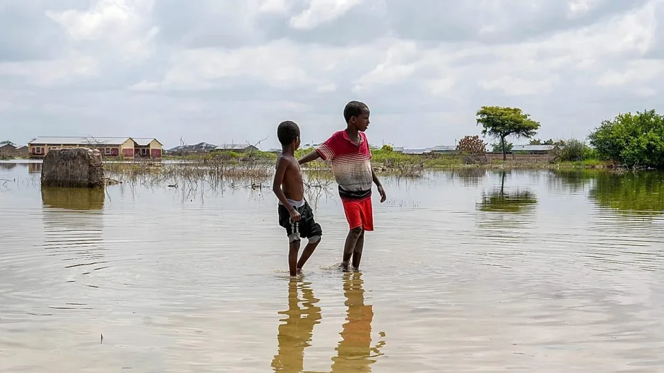 Children walk through a flooded field in Mandera County, Kenya — AP Photo/Brian Inganga, File